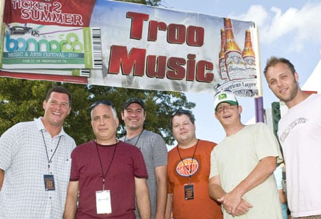 The Troo Music Tent at the Bonnaroo featured Nashville bands The Features, The Protomen, and Heypenny. In addition to sharing Nashville roots, the three groups also won festival slots through “The Road to Bonnaroo” competition, co-sponsored by BMI, Bud Select, and venue partner, Mercy Lounge. Pictured at the Troo Music Tent are (l-r): BMI Sr. Dir., Writer/Publisher Relations Mark Mason, Bonnaroo co-founder and producer and AC Entertainment President Ashley Capps, Mercy Lounge GM Drew Mischke, BMI Dir. of Writer/Publisher Relations Bradley Collins, BMI Asst. VP Writer/Publisher Relations Clay Bradley, and BMI Assc. Dir., Writer/Publisher Relations Dave Claassen. Photo by Erika Goldring