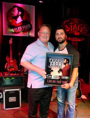 Pictured (L-R): Sony Music Nashville Chairman and CEO Gary Overton and Columbia Nashville artist Tyler Farr celebrate 5 million views on VEVO for “Redneck Crazy.” Photo credit: Alan Poizner