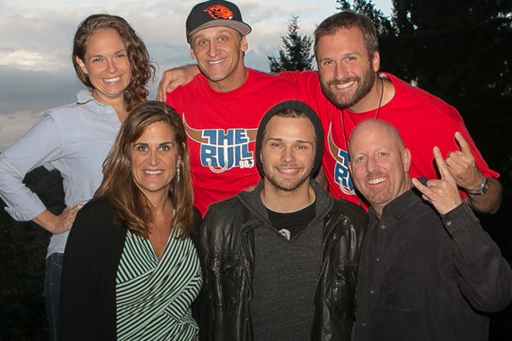 One lucky KUPL winner and 50 of their friends were treated to a Joel Crouse acoustic backyard show. Pictured (back row):  KUPL Morning show DJs Monica, Howie and Jake.(front row): SDU’s Lisa Owen, Crouse and KUPL Promotion Director