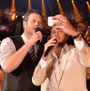 Selfie time! Co-hosts Luke Bryan and Blake Shelton search for the biggest stars in the room—decide they are the biggest stars. 