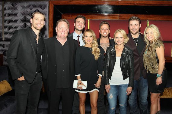 Chase Rice, Overton, Love and Theft’s Eric Gunderson, Carrie Underwood, Love and Theft’s Stephen Barker Liles, Miranda Lambert, Chris Young, and Leah Turner. Photo:  Meishach Moore / Christie’s Photographic Solutions 