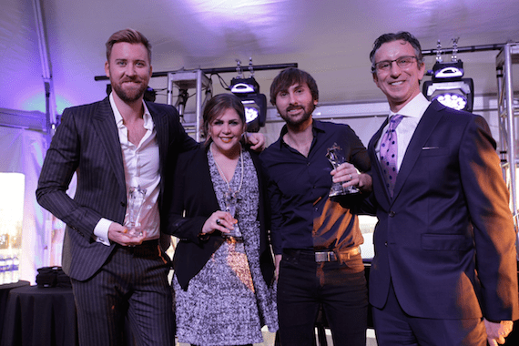 Pictured (L-R): Lady A’s Charles Kelly, Hillary Scott, Dave Haywood and NMPA CEO David Israelite. 