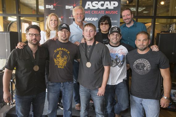 Celebrating Jason Aldean’s No. 1 hit “Just Gettin’ Started.” (L-R): (back row): BMI’s Leslie Roberts, Combustion Music’s Chris Farren, ASCAP’s John Titta and Sony/ATV’s Josh VanValkenburg. (Front row): songwriter Chris DeStefano, BMI affiliate Jason Aldean, songwriter Ashley Gorely, BMI songwriter Rhett Akins and producer Michael Knox.