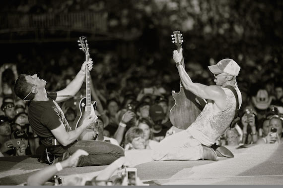 Kenny Chesney with guitarist Clayton Mitchell on August 1 at Arrowhead Stadium Credit: Jill Trunnell 