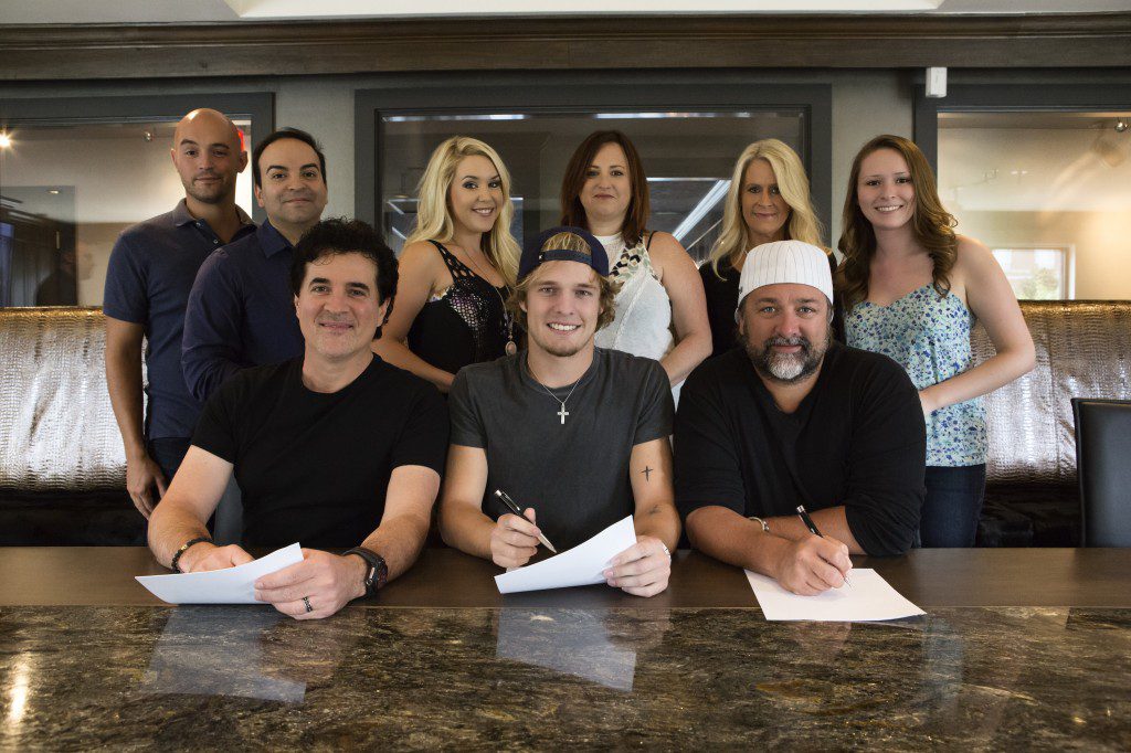 Pictured (L-R): Back Row – Big Machine Music’s Alex Heddle, Mike Molinar, Tali Canterbury, Manager Mary Hilliard Harrington, Big Machine Label Group’s Allison Jones and Big Machine Music’s Brianna Steinitz Front Row – BMLG’s Scott Borchetta, Tucker Beathard & Dot Records’ Chris Stacey Photo Credit: Seth Hellman for Dot Records.