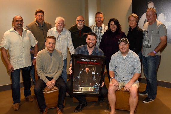Sony Music Nashville presented Chris Young with a plaque celebrating the recent RIAA Gold certification of his current single, “I’m Comin’ Over.” Back Row (L-R): Paul Barnabee (SVP, Marketing, Sony Music Nashville), Jim Catino (VP, A&R, Sony Music Nashville), Bill Simmons (Fitzgerald Hartley), Larry Fitzgerald (Fitzgerald Hartley), Steve Hodges (EVP, Promotions & Artist Development, Sony Music Nashville), Caryl Healey (VP, Sales, Sony Music Nashville), Angie Magill (VP, Legal & Business Affairs, Sony Music Nashville), Keith Gale (SVP/National Promotion, RCA) Front Row (L-R): Randy Goodman (Chairman & CEO, Sony Music Nashville), Young, Josh Easler (Director/National Promotion, RCA) Photo: Rick Diamond/Getty Images for Sony Music Nashville