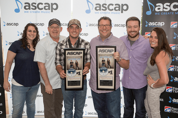 Cole Taylor poses with UMPG staff. Pictured (L-R): Missy Roberts; Ron Stuve; Cole Taylor; Kent Earls, Executive VP/GM, UMPG; Travis Gordon; Missy Roberts; and Amelia Varni