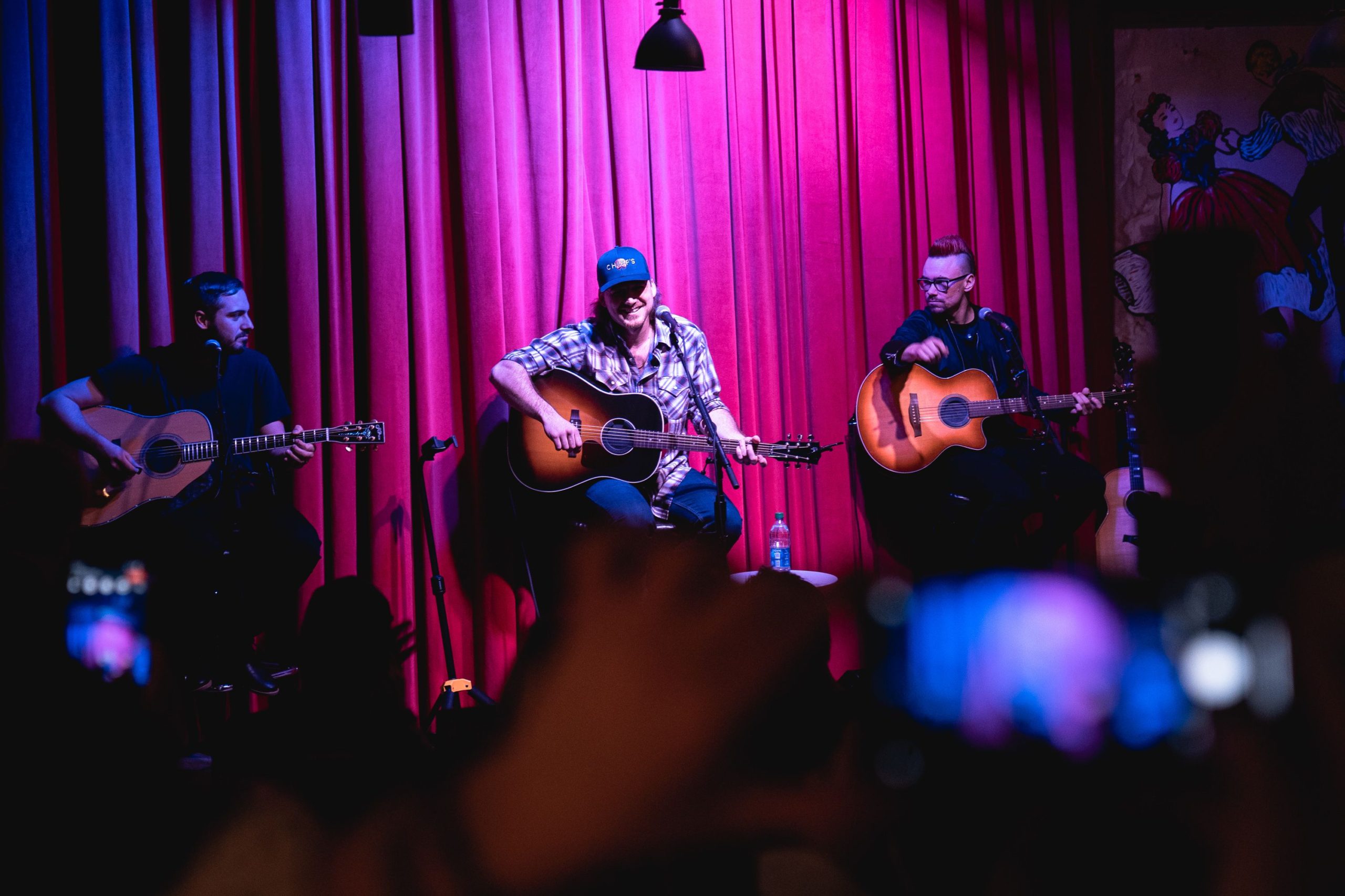 Morgan Wallen performing on stage in 2021